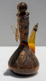 בקבוק ספרדי ישן מעור זכוכית מתכת ועץ, במראה הרפתקני נהדר